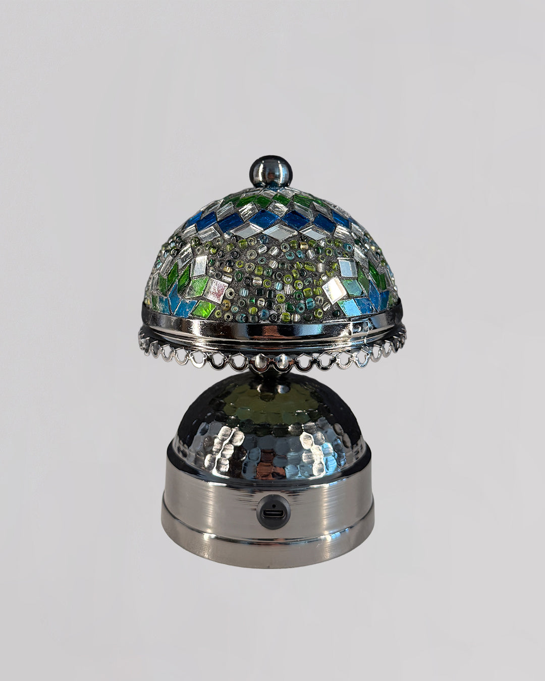 Decorative bell with mosaic top on a gray background