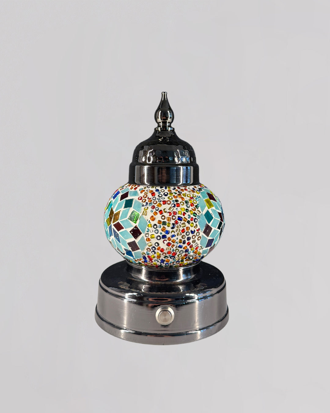 Decorative lamp with mosaic design on a white background