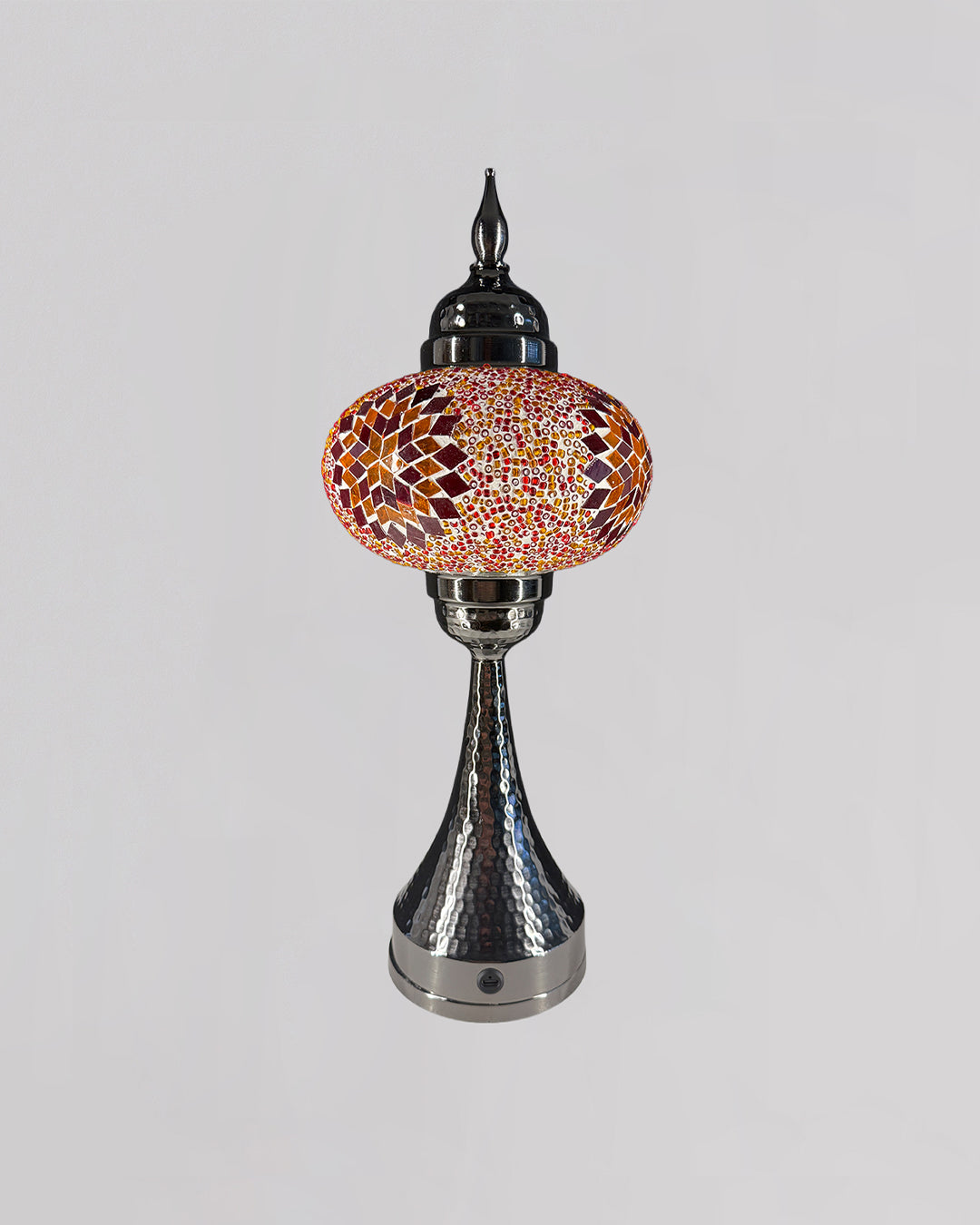 Decorative lamp with mosaic design on a gray background