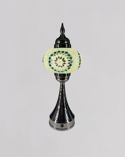 Decorative lamp with a green and white pattern on a gray background