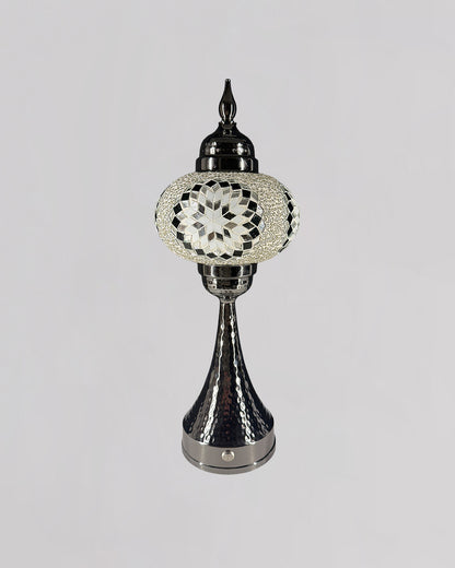 Decorative lamp with intricate design on a gray background