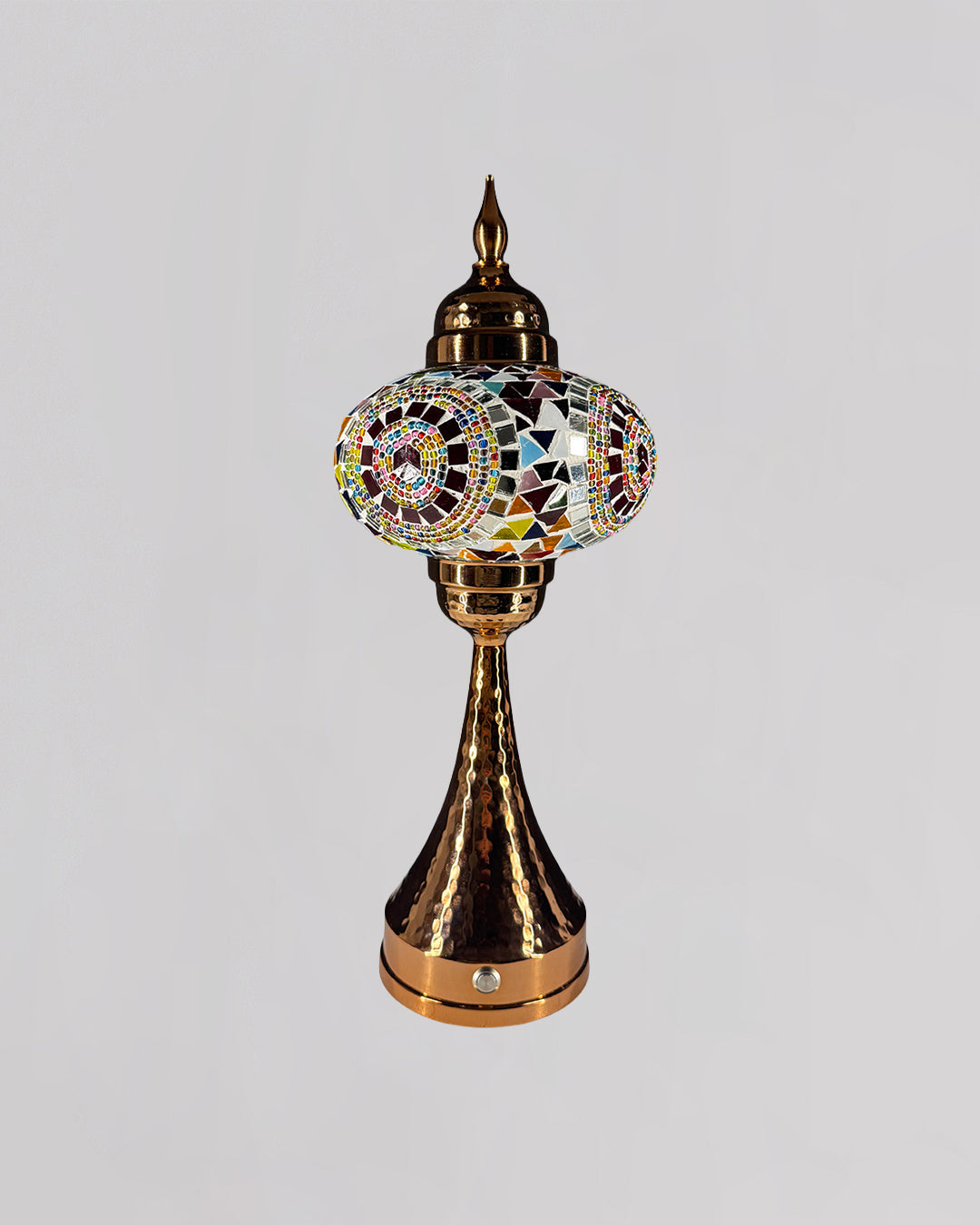 Decorative lamp with colorful mosaic design on a gray background