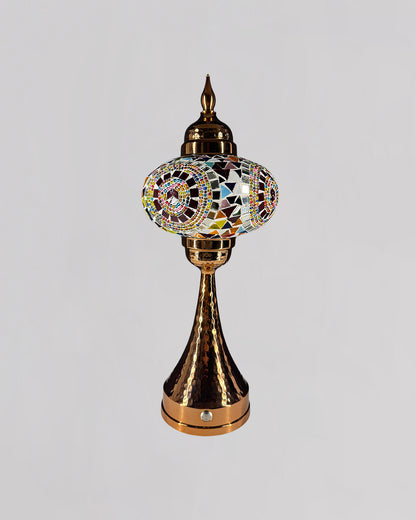Decorative lamp with colorful mosaic design on a gray background