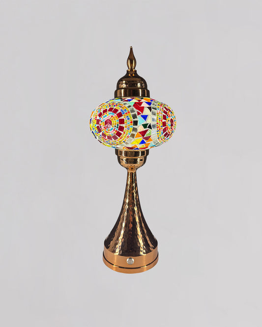 Decorative lamp with colorful mosaic design on a gray background