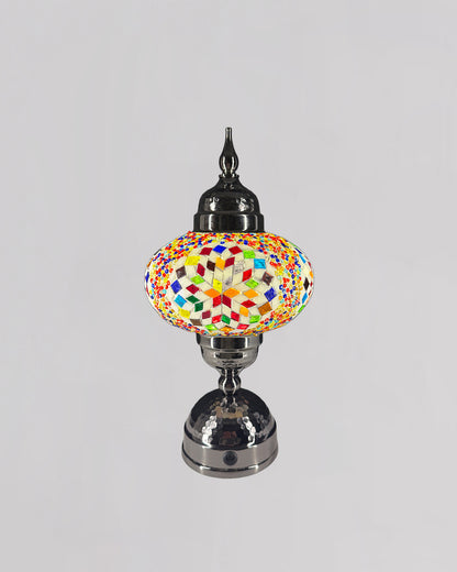 Colorful mosaic lamp on a gray background