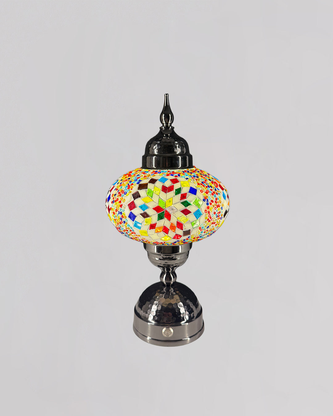 Decorative lamp with a colorful glass shade on a gray background