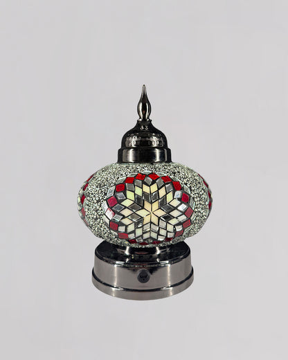 Decorative lamp with mosaic design on a gray background