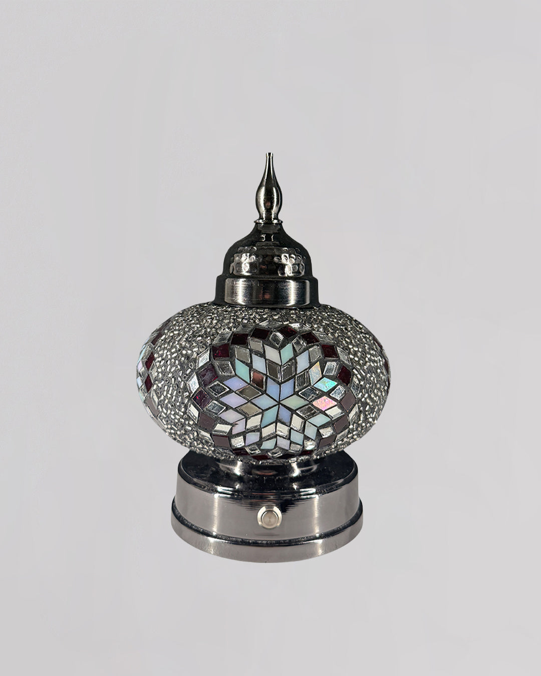 Decorative lamp with mosaic design on a gray background