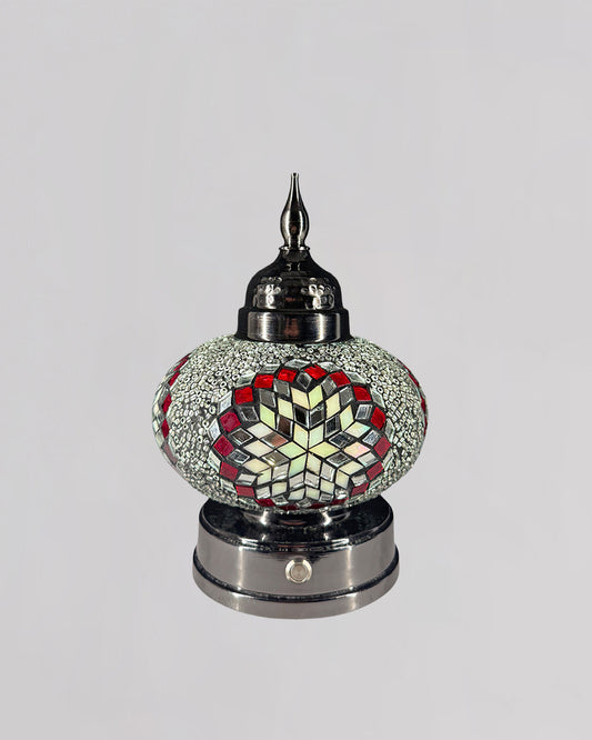Decorative lamp with mosaic design on a gray background