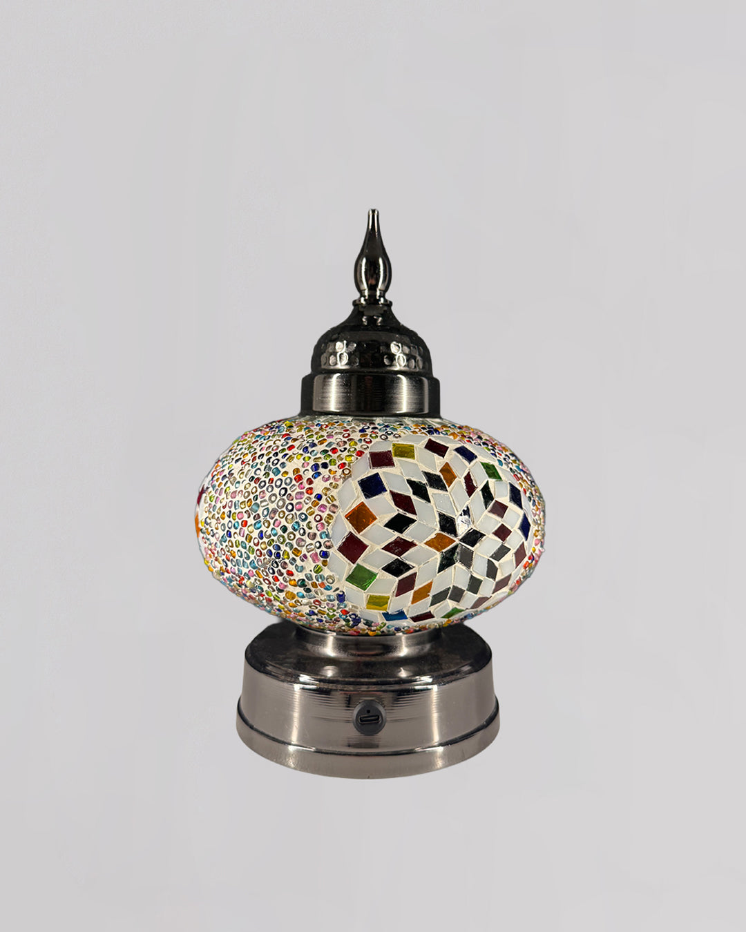Decorative lamp with mosaic design on a white background