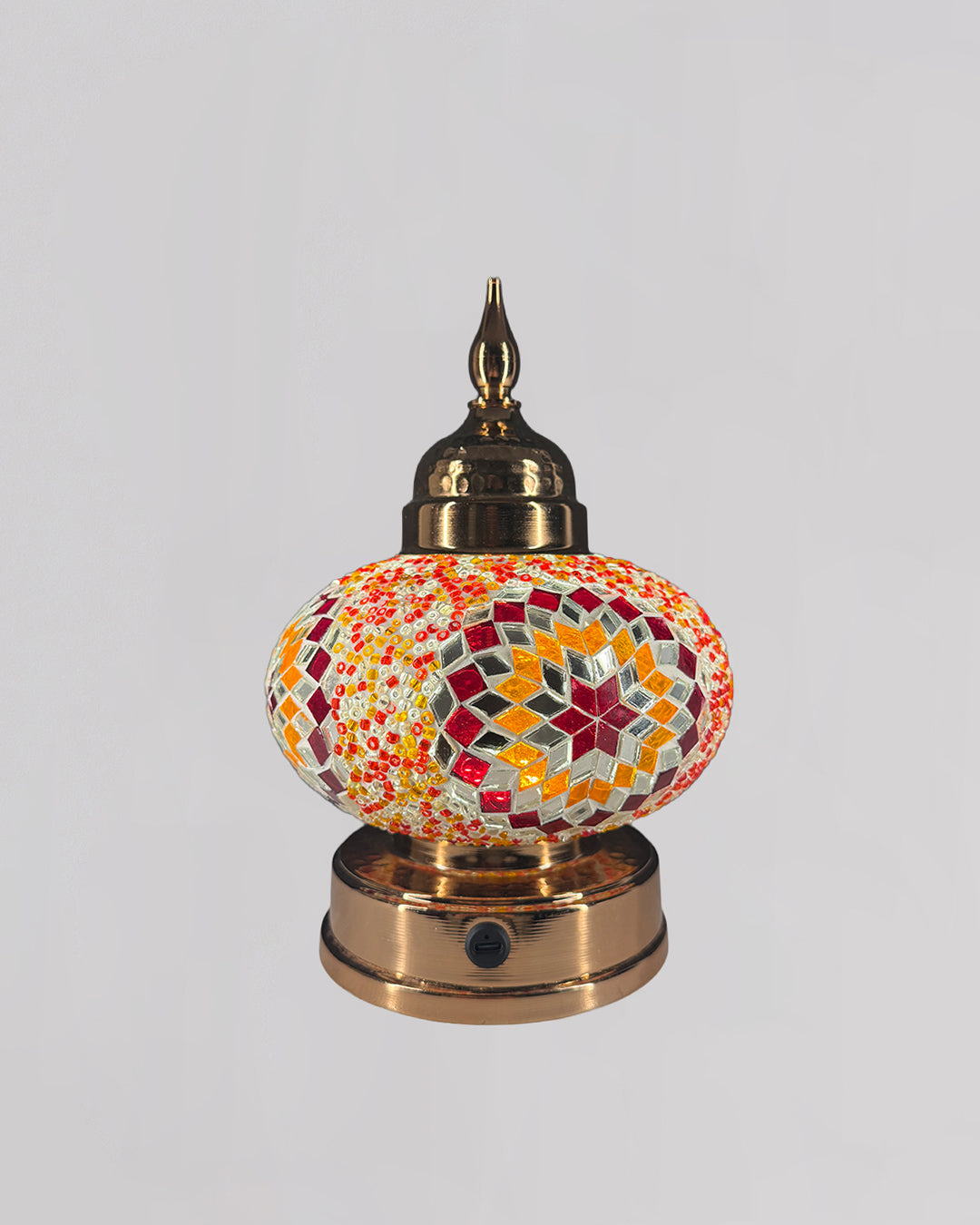 Decorative lamp with mosaic design on a white background