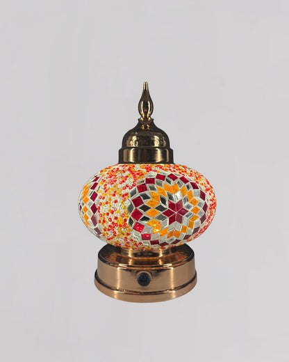 Decorative lamp with mosaic design on a white background