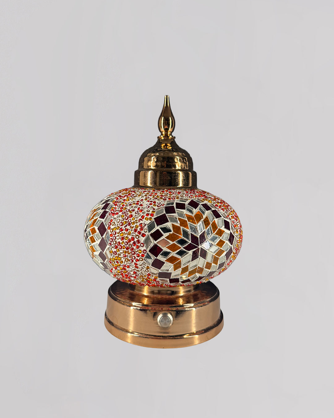 Decorative lamp with mosaic design on a white background