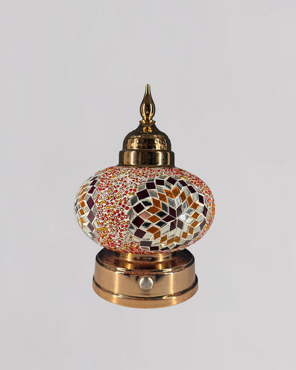 Decorative lamp with mosaic design on a white background