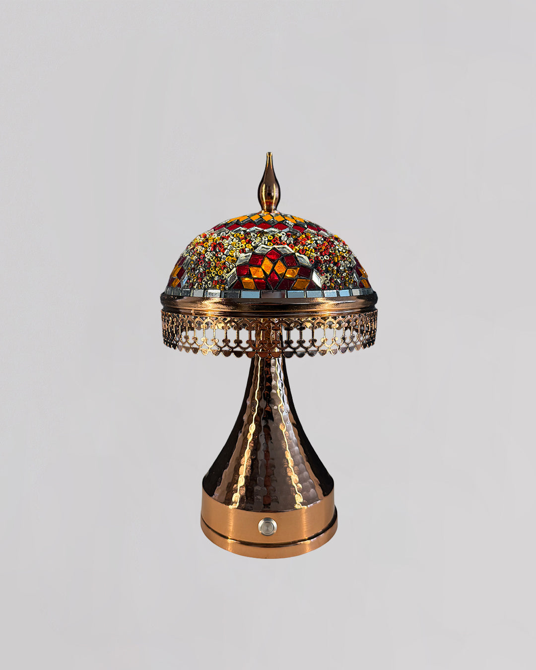 Decorative lamp with mosaic top on a gray background