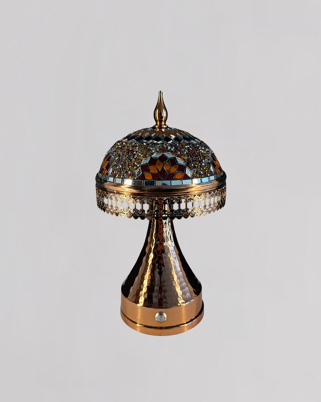 Decorative lamp with intricate design on a gray background