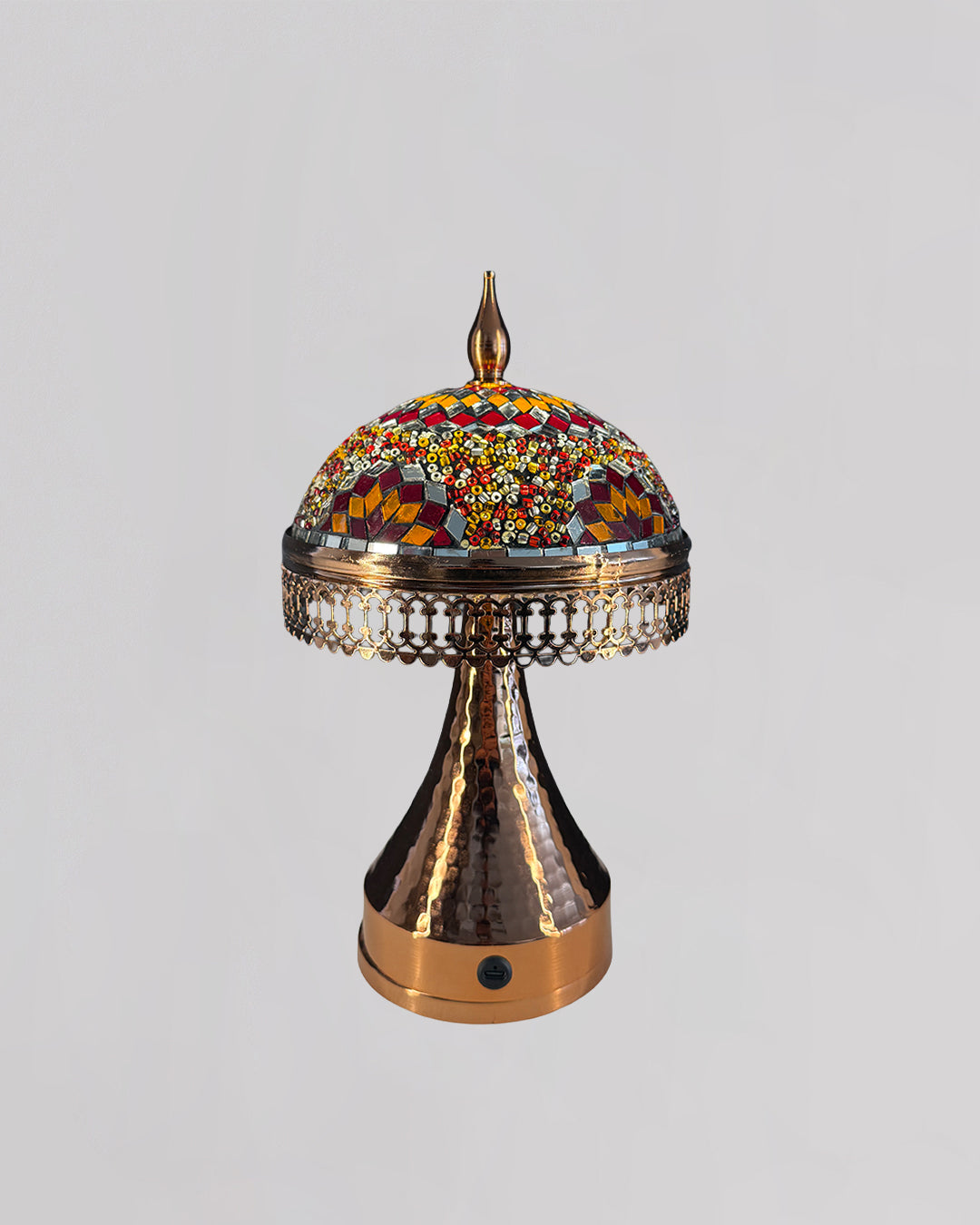 Decorative lamp with mosaic top on a gray background
