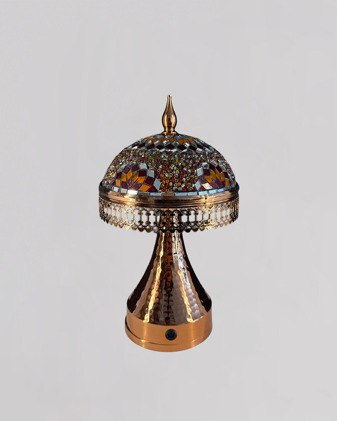 Decorative lamp with intricate design on a gray background