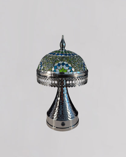 Decorative lamp with a mosaic top on a gray background