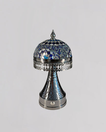 Decorative silver and blue object on a gray background