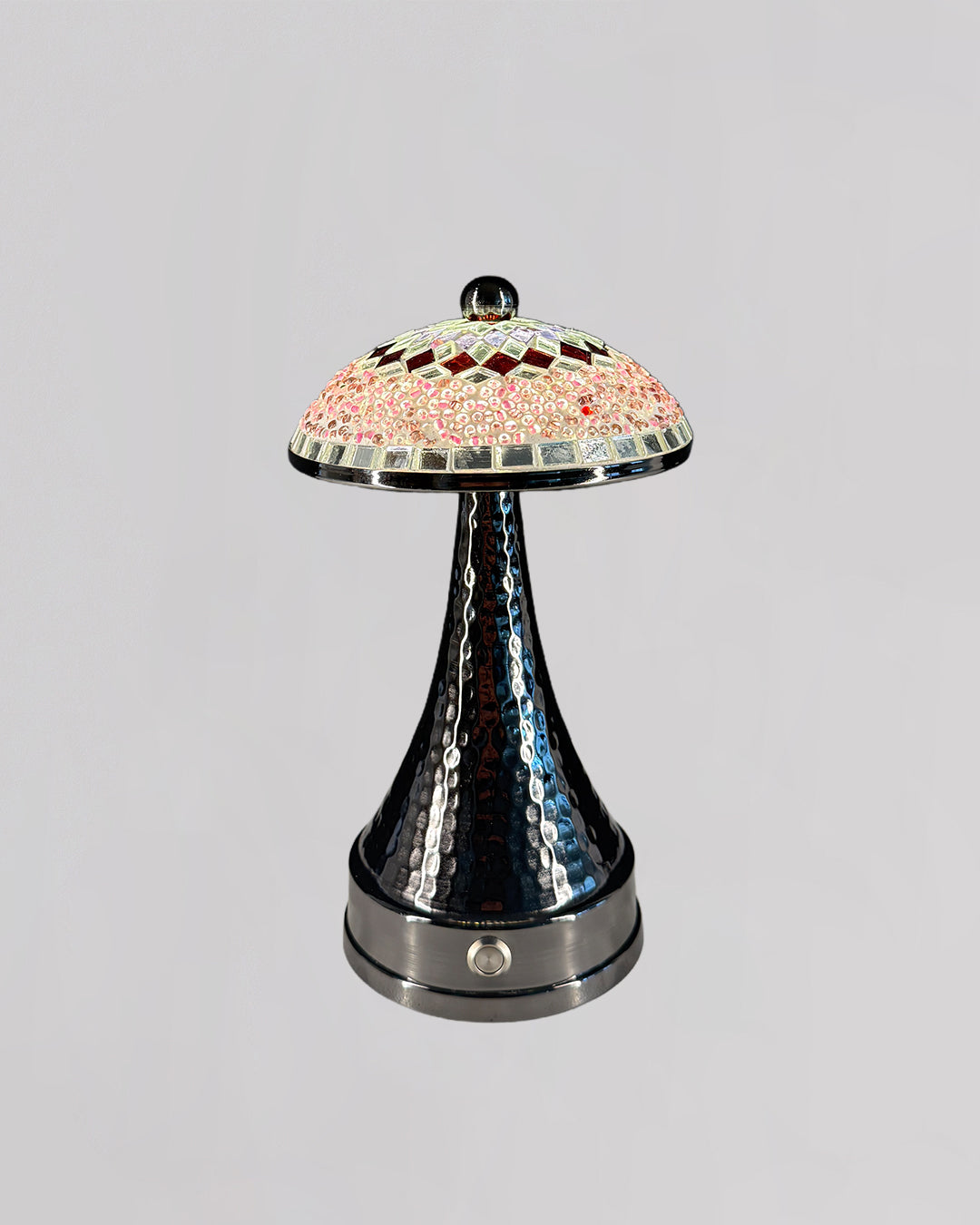 Decorative lamp with a colorful glass shade on a gray background