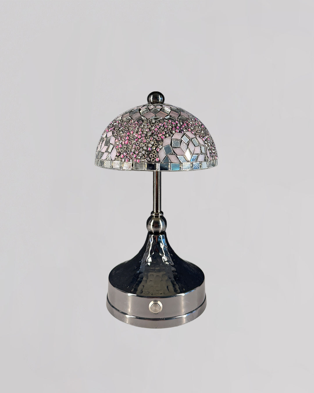 Decorative table lamp with mosaic design on a gray background