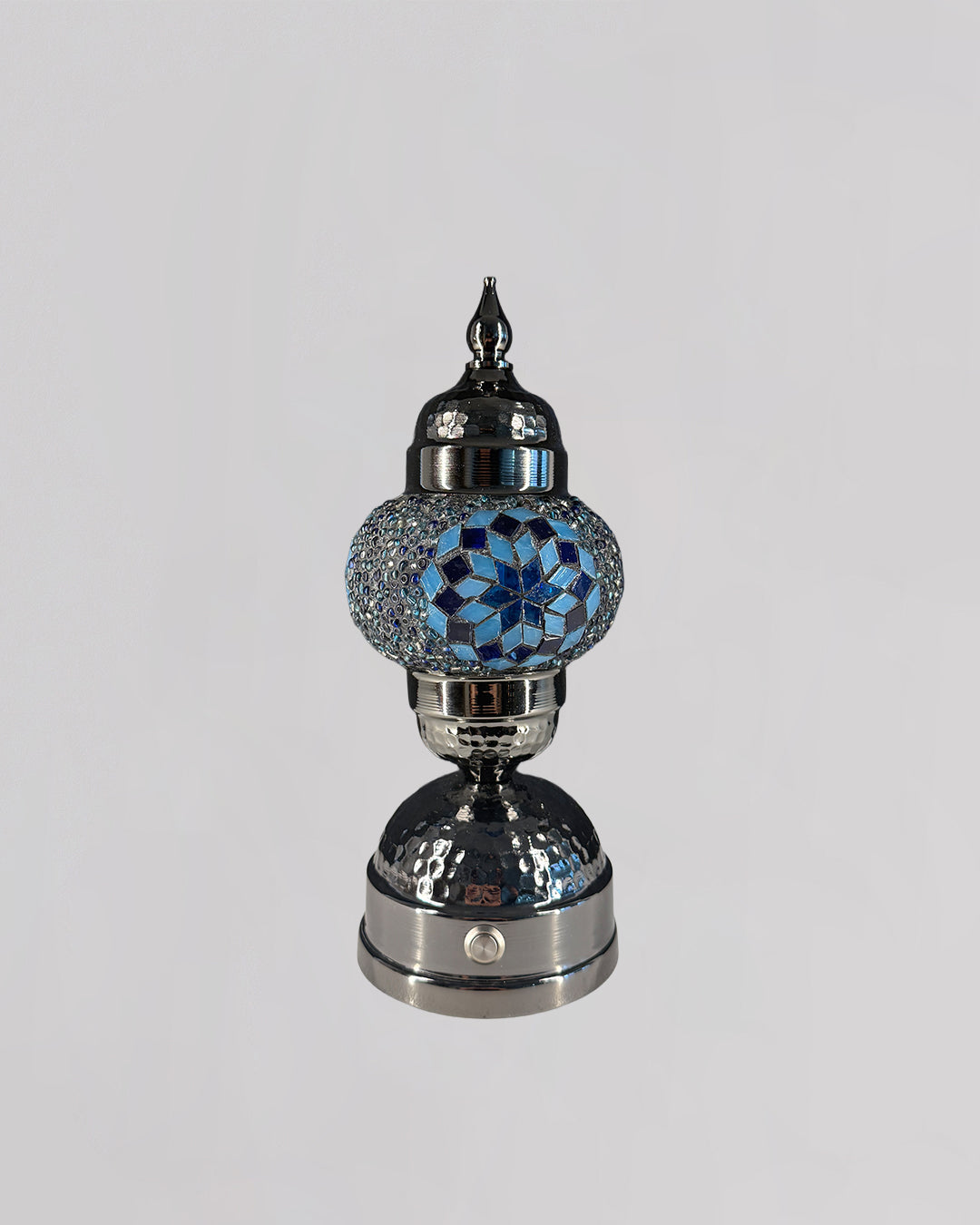Decorative lamp with blue crystal design on a gray background