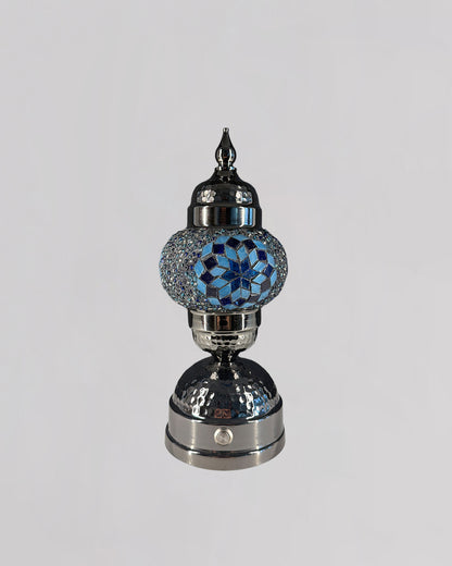 Decorative lamp with blue crystal design on a gray background