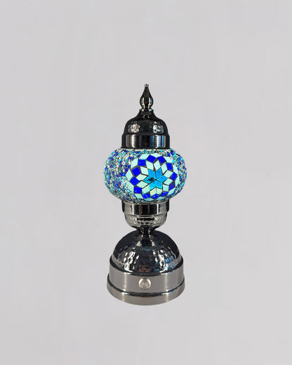 Decorative lamp with a blue and silver design on a gray background