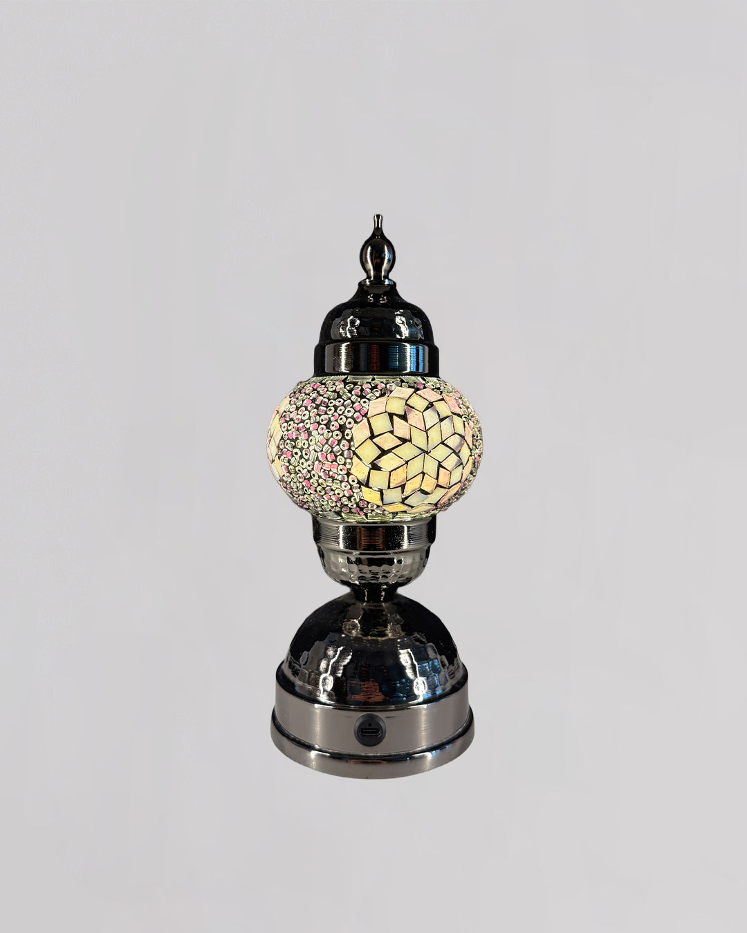 Decorative lamp with mosaic design on a gray background