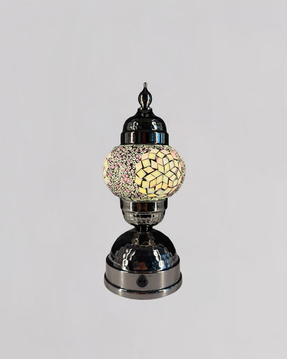 Decorative lamp with mosaic design on a gray background