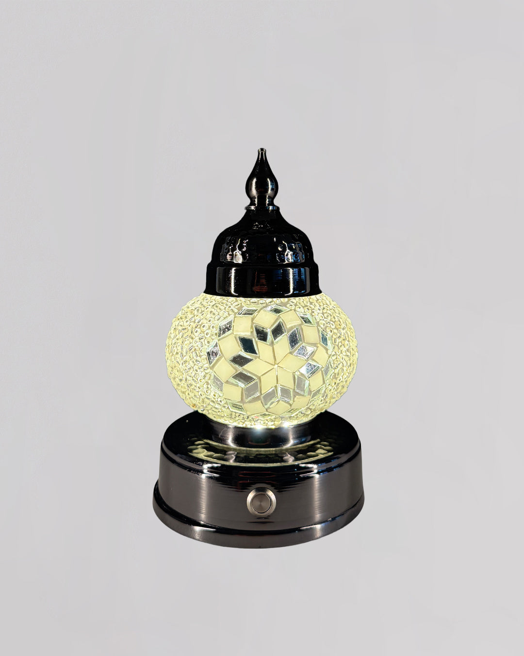 Decorative lamp with a glass shade on a gray background