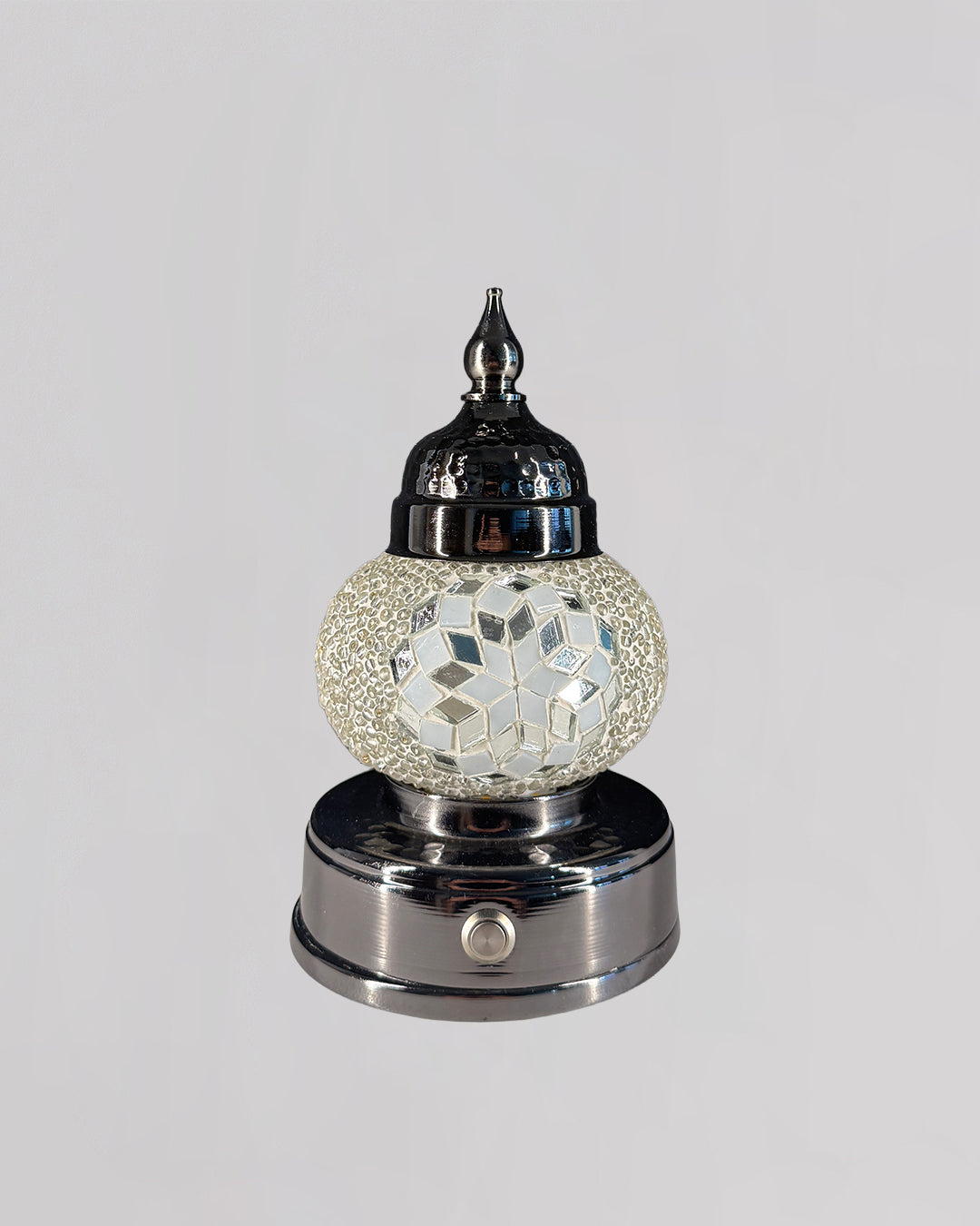 Decorative lamp with mosaic design on a white background