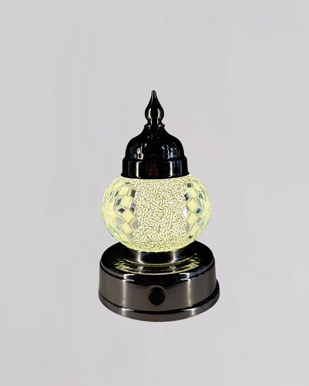 Decorative lamp with a textured glass shade on a gray background