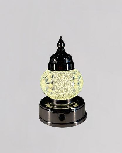 Decorative lamp with a textured glass shade on a gray background