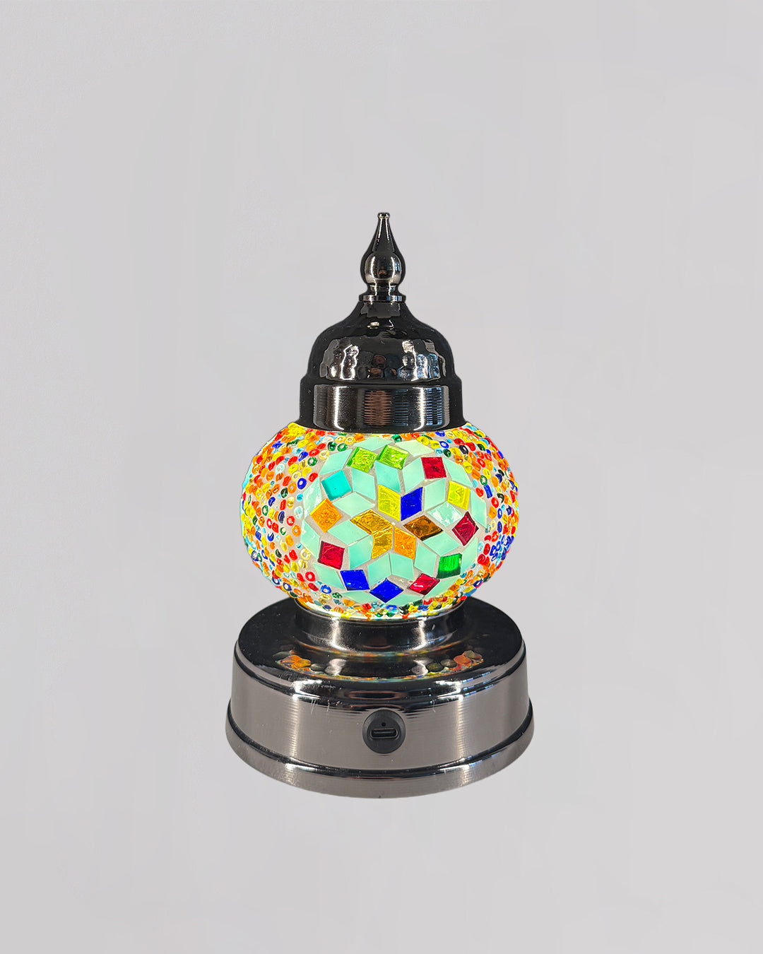 Decorative lamp with colorful mosaic design on a white background