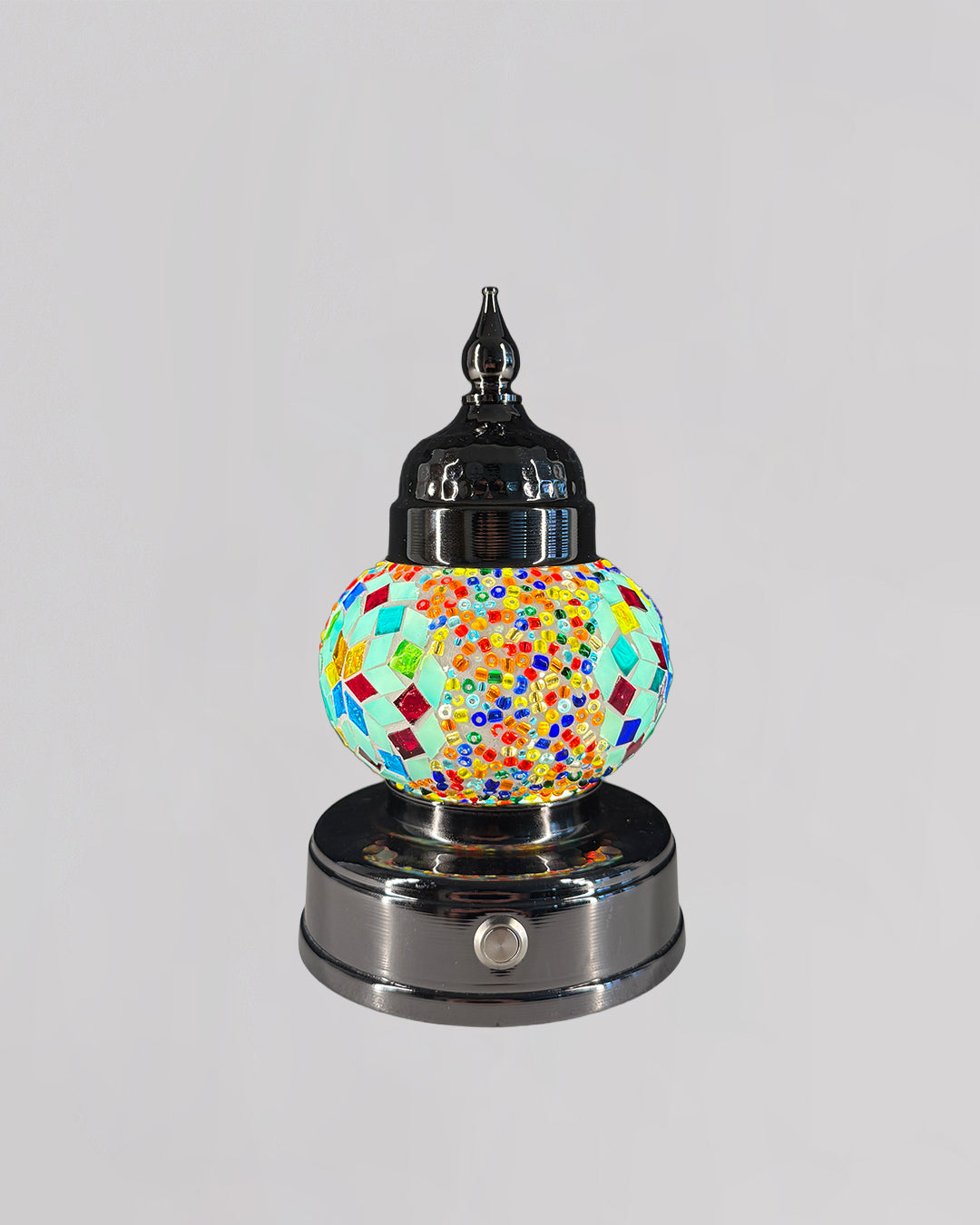 Decorative lamp with colorful mosaic design on a gray background